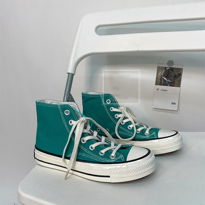 Unisex kõrged naiste lõuendjalatsid Meeste vabaaja sörkimisjalatsid Tudengite Vulcanize kingad Nööritavad naiste tossud Zapatos De Mujeres