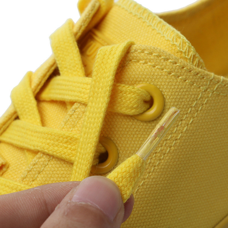 Tüdrukute valged tossud sidrunkollased lõuendist kingad Kvaliteetsed libisemisvastased kõik mustad vulkaniseeritud kingad Lameda kontsaga paeltega madalad jalatsid