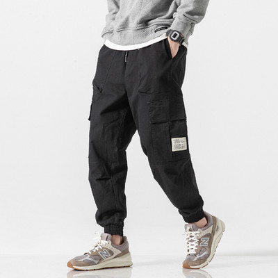 Klasična ulična odjeća Ležerne muške vrpce Haremske hlače za trčanje Muške uske proljetne hlače s više džepova Ženske hlače T23