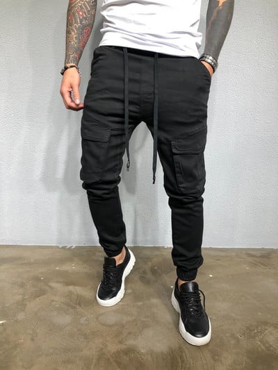 Muscle Meeste Uus Tide Bränd õhukesed spordipüksid Moodsad Jalad vabaaja mitme taskuga kombinesoonid Kulturismi spordi jooksupüksid