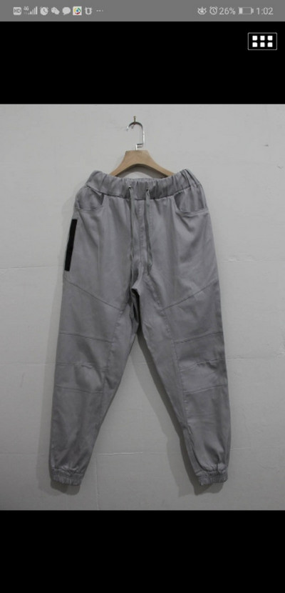 Ležerni muški kombinezon Fitness Territory Novi proizvodi Jednobojni uski muški kombinezon s više džepova Hlače