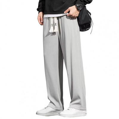 Meeste vabaaja püksid ühevärvilised pingutusnöörid elastne vöökoht lahtised pikad püksid sirged laia säärega püksid vabaaja spordipüksid pikad püksid