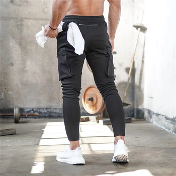 Модни шевове Мъжки панталони Фитнес Ежедневни еластични панталони Мъжки бодибилдинг облекло Ежедневни спортни панталони с няколко джоба Джогери Панталони