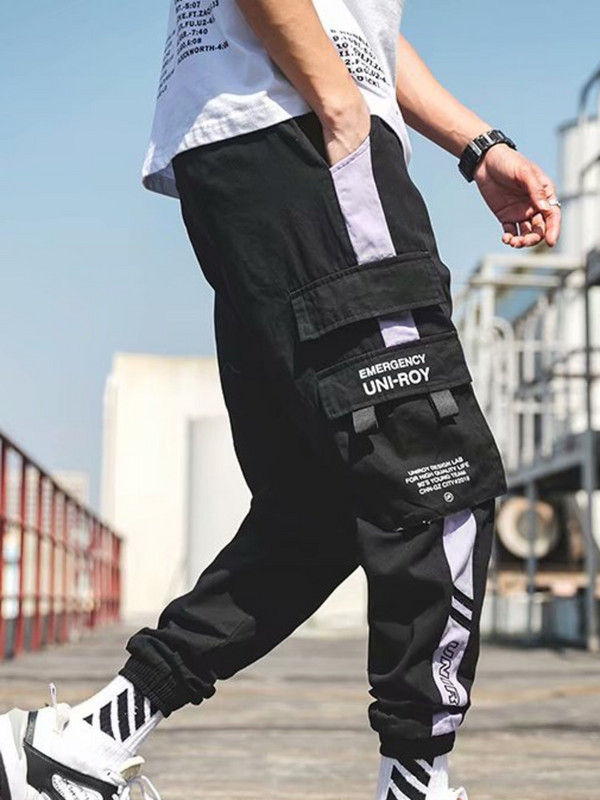 PFNW meeste kaubapüksid Techwear Funktsionaalne Tuule Kontrastvärv Elastne Vöökoht Splicing High Street Streetwear Püksid Mees