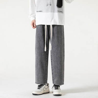 2023. aasta kevadsuvi, uued meeste sirge sääre ja laia säärega teksad Korea moodsa nööriga disainiga kottis pahkluuni ulatuvad meeste püksid