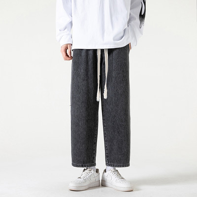 2023. aasta kevadsuvi, uued meeste sirge sääre ja laia säärega teksad Korea moodsa nööriga disainiga kottis pahkluuni ulatuvad meeste püksid