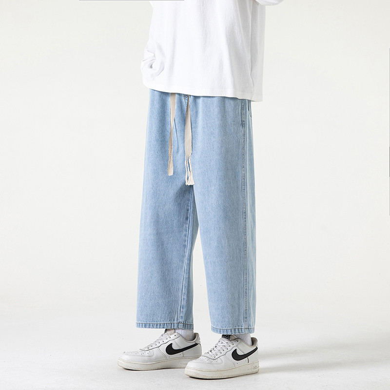 2023. aasta kevadsuvi, uued meeste sirge sääre ja laia säärega teksad Korea moodsa nööriga disainiga kottis pahkluuni ulatuvad meeste püksid