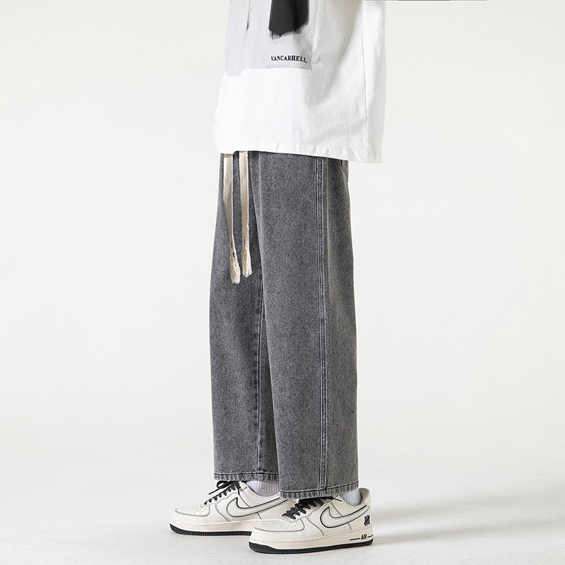 2023. aasta kevadsuvi, uued meeste sirge sääre ja laia säärega teksad Korea moodsa nööriga disainiga kottis pahkluuni ulatuvad meeste püksid