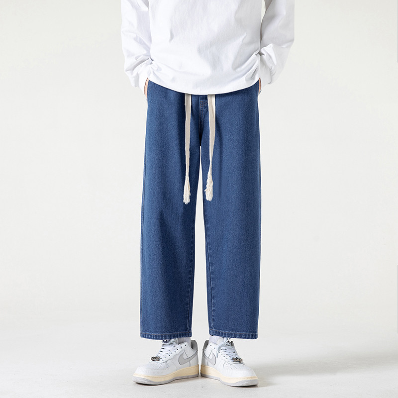 2023. aasta kevadsuvi, uued meeste sirge sääre ja laia säärega teksad Korea moodsa nööriga disainiga kottis pahkluuni ulatuvad meeste püksid