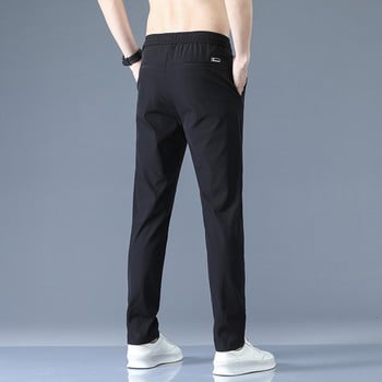 2023 Мъжки панталони Пролет Лято Нови тънки зелени едноцветни модни джобни апликации Ежедневни работни панталони с пълна дължина Панталон