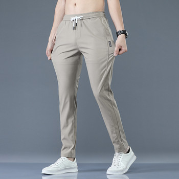 2023 Мъжки панталони Пролет Лято Нови тънки зелени едноцветни модни джобни апликации Ежедневни работни панталони с пълна дължина Панталон