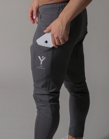 2023 Мъжки спортни фитнес зали Тънки панталони за фитнес джогинг Мъжки ежедневни панталони тип молив Модни тесни спортни панталони с цип от чист памук