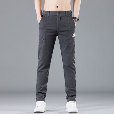 Proljeće ljeto Dizajn elastičnog struka Muške tanke ležerne hlače Korejske modne pamučne rastezljive poslovne hlače Muške sive plave