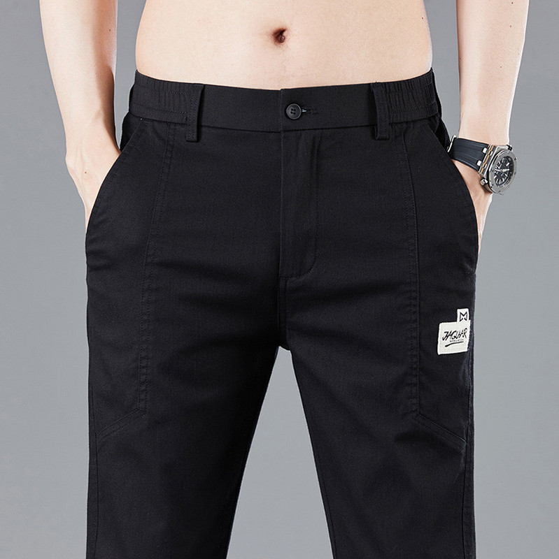 Proljeće ljeto Dizajn elastičnog struka Muške tanke ležerne hlače Korejske modne pamučne rastezljive poslovne hlače Muške sive plave