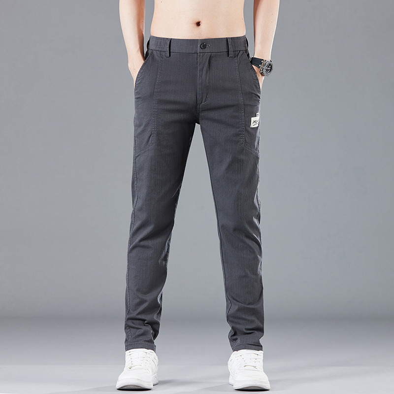 Proljeće ljeto Dizajn elastičnog struka Muške tanke ležerne hlače Korejske modne pamučne rastezljive poslovne hlače Muške sive plave