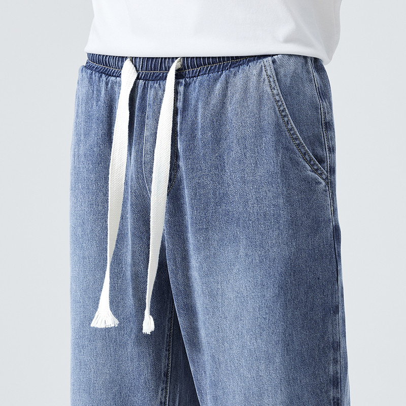 Ljeto visoke kvalitete 100% liocel mekane muške traperice tanke labave sužene hlače s elastičnom uzicom u struku Korejske ležerne hlače muške