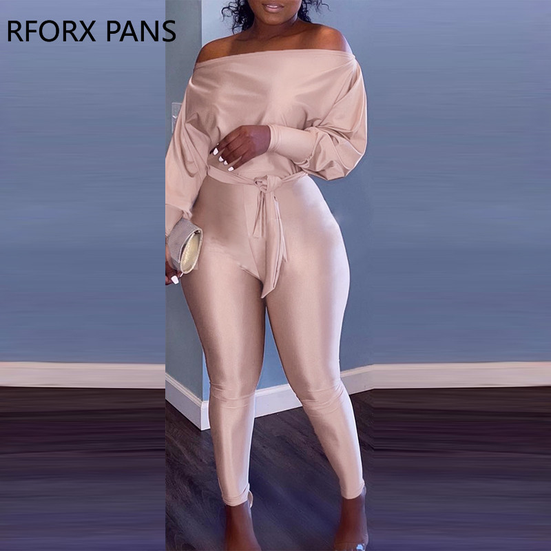 Ženski elegantni kombinezon s otvorenim ramenima i dugim rukavima, jednobojni, uski nogavica s remenom