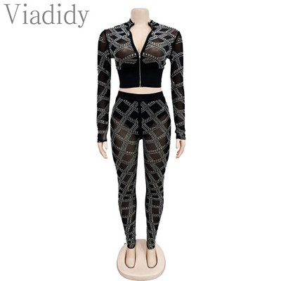 Ženska seksi majica dugih rukava s prozirnim mrežastim patentnim zatvaračem i uskim hlačama visokog struka