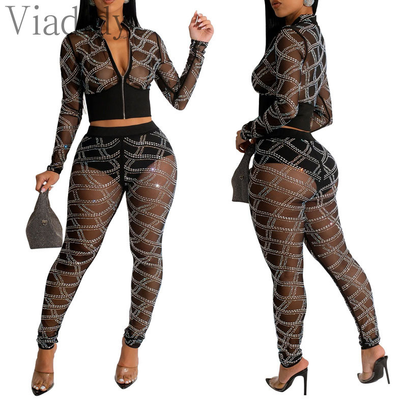 Ženska seksi majica dugih rukava s prozirnim mrežastim patentnim zatvaračem i uskim hlačama visokog struka