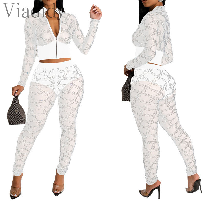 Ženska seksi majica dugih rukava s prozirnim mrežastim patentnim zatvaračem i uskim hlačama visokog struka