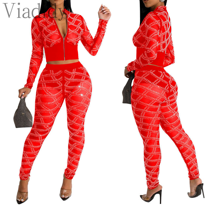 Ženska seksi majica dugih rukava s prozirnim mrežastim patentnim zatvaračem i uskim hlačama visokog struka