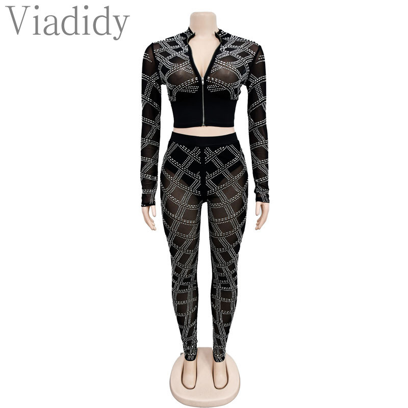 Ženska seksi majica dugih rukava s prozirnim mrežastim patentnim zatvaračem i uskim hlačama visokog struka