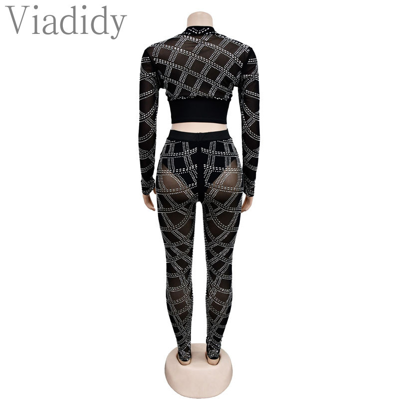 Ženska seksi majica dugih rukava s prozirnim mrežastim patentnim zatvaračem i uskim hlačama visokog struka