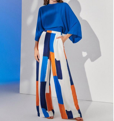 Moodne kaheosaline naisteriietus 2023. aasta suvine avar ülaosa, kõrge vöökohaga, trükitud elegantne kontori laiade säärtega pükste komplekt, riided