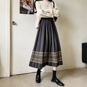 Retro vilnonis languotas sijonas rudens ir žiemos moterų tarpukojis aukštu juosmeniu yra plonesnis vidutinio ilgio etninio stiliaus klostuotas A formos sijonas