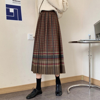 Retro vilnonis languotas sijonas rudens ir žiemos moterų tarpukojis aukštu juosmeniu yra plonesnis vidutinio ilgio etninio stiliaus klostuotas A formos sijonas