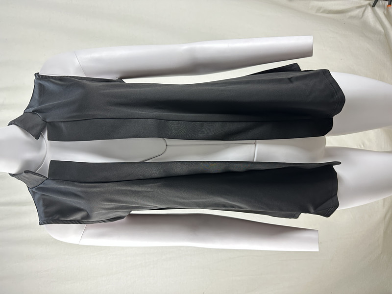 Ljetna prekogranična trgovina nove Europe i Sjedinjenih Država ženskog temperamentnog kardigana od jednobojnog prsluka