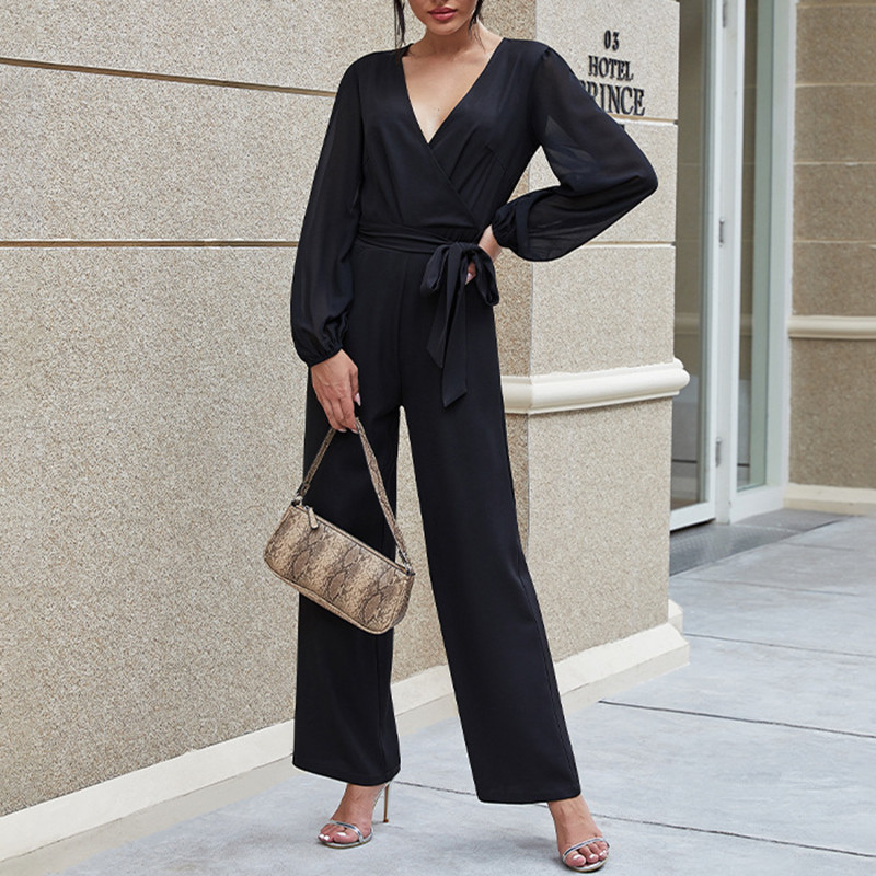 Dámsky sexy overal s hlbokým výstrihom do V, vysokým pásom, opaskom a dlhým rukávom, zaväzovaním v páse, priliehavým rukávom, formálnym večerným overalom