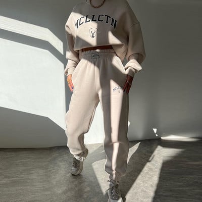 Soe kostüüm sügistalvine naiste soliidne komplekt Elegantne O-kaelusega pullover kapuuts ja taskupüksid kaheosaline komplekt Naiste vabaaja komplektid