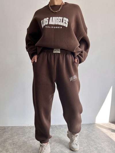 Soe kostüüm sügistalvine naiste soliidne komplekt Elegantne O-kaelusega pullover kapuuts ja taskupüksid kaheosaline komplekt Naiste vabaaja komplektid