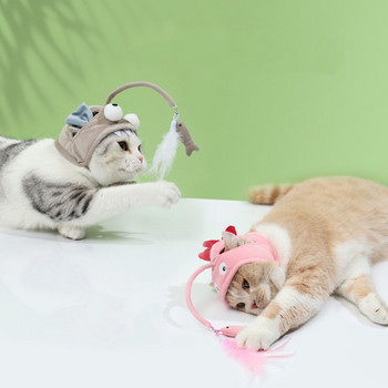 Кучета и котки главата носят пера дразни котешка пръчка малък динозавър котешка покривка за глава забавно сиво голямо око риба котка играчки за самопомощ