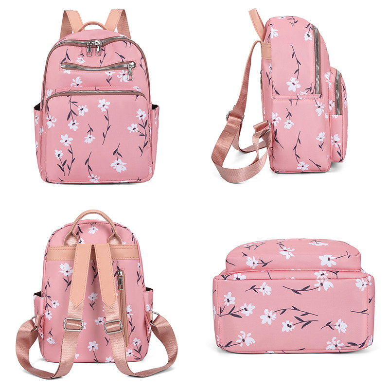 Mitmekülgne lilledega dekoratiivne seljakott Luksuslik naiste disainiga seljakotid 2023 Pritsmekindlast nailonist reisikoolikott Sac A Dos
