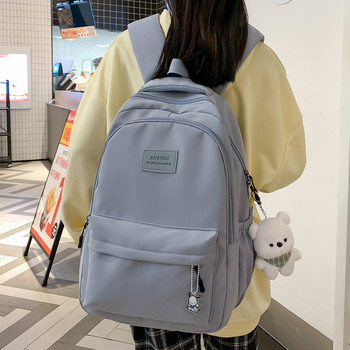 Модна едноцветна найлонова чанта за книги 2023 лятна ученическа чанта за момичета с голям капацитет Студентска раница със сладка висулка раница
