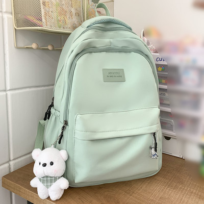 Modna jednobojna najlonska torba za knjige 2023., ljetna djevojačka školska torba, studentski ruksak velikog kapaciteta sa slatkim ruksakom s privjeskom