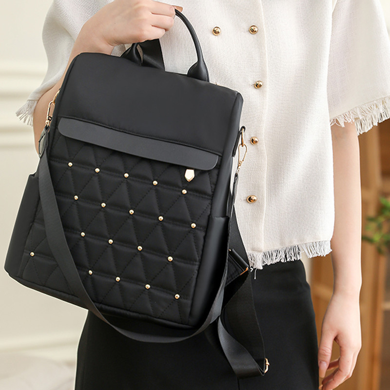 Naiste seljakott suure mahutavusega vabaaja reisikott Lihtne ühevärviline õlakott Kvaliteetne nailonist riidest kotikott Mochilas