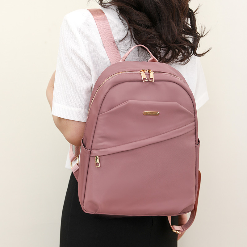 Kiváló minőségű nylon vászon hátizsák Divattervező nagy kapacitású lány iskolatáska egyszínű szabadidős utazási hátizsákok 2023 Új