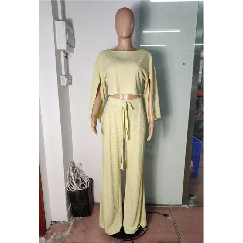 Uus suures suuruses naisteriiete kaheosaline komplekt vabaaja libisevate varrukatega, ribidega ülivenivad elegantsed pükstekomplektid, hulgimüük