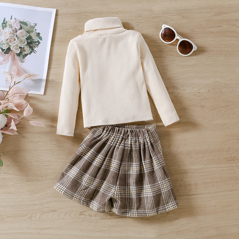 Kaheosaline komplekt uutest tüdrukute kevad- ja sügisestest topidest ja ruudulisest seelikust väikestele ja keskmise suurusega lastele