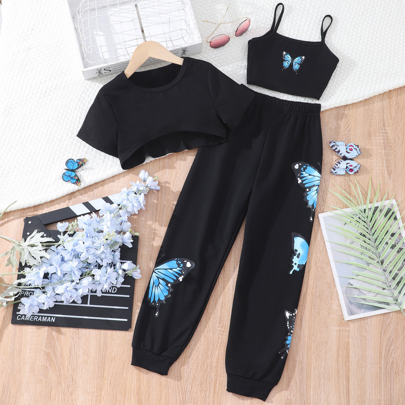 Tüdrukute suvemoodne kolmeosaline komplekt, mis on ühendatud lühikeste varrukatega T-särkide liblikarihmade ja pükste kolmeosalise komplektiga