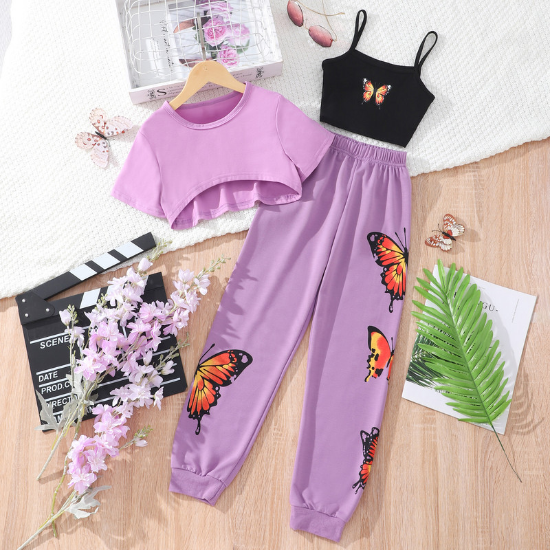 Tüdrukute suvemoodne kolmeosaline komplekt, mis on ühendatud lühikeste varrukatega T-särkide liblikarihmade ja pükste kolmeosalise komplektiga