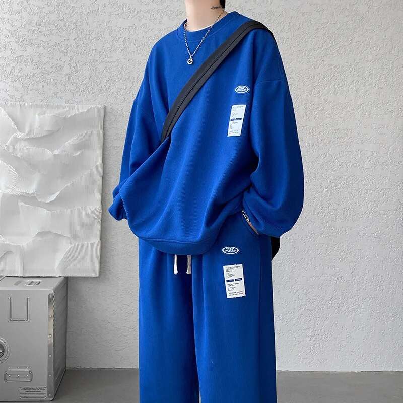 Μοντέρνο ανδρικό αθλητικό σετ άνοιξης και φθινοπώρου 2023 Μακρυμάνικο πουλόβερ Patch Μεγάλο casual παντελόνι Σετ δύο τεμαχίων