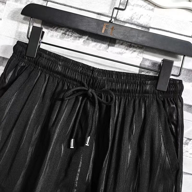 Nyári új bő kétrészes szett férfi rövid ujjú póló húzózsinóros nadrág koreai ráncos sport alkalmi öltöny trend férfi ruhák