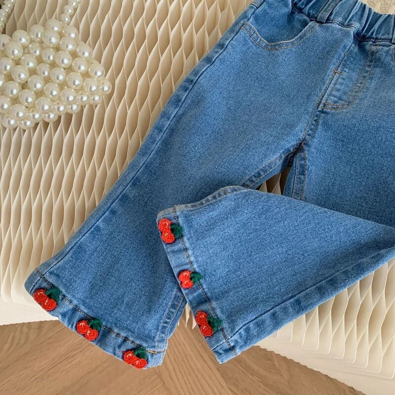 Bērnu meiteņu džinsi 0–6 gadi, mazuļi, bērni, elastīgi jostasvietas, ķiršu izšuvumi, džinsa auduma bikses, zvaniņš apakšā, ikdienas apģērbi, korejiešu apģērbi