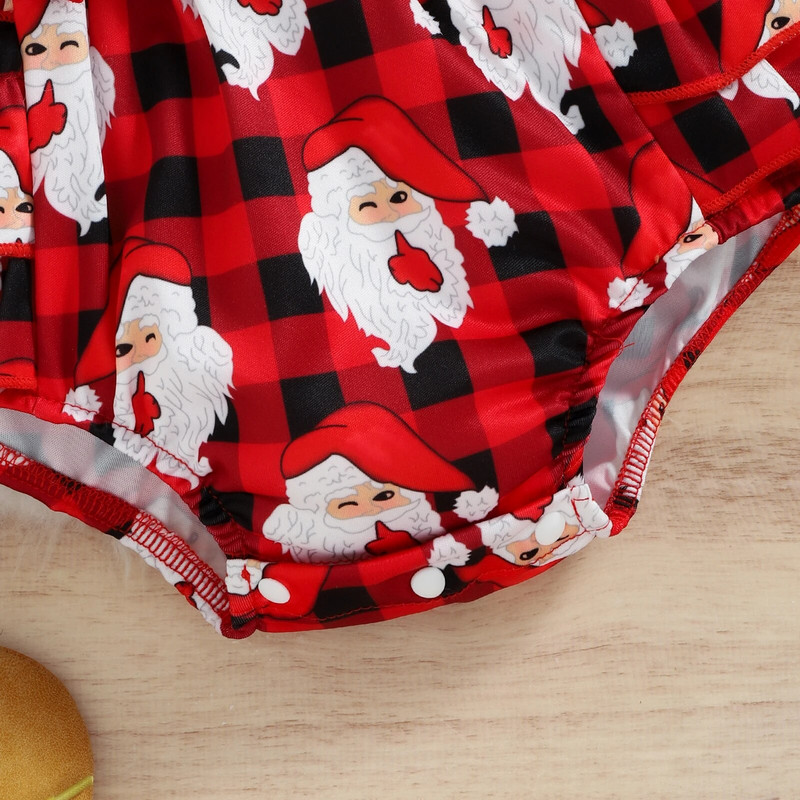 Ziemassvētku rombiņas zīdaiņiem, volāniem, garām piedurknēm, rūtaini Ziemassvētku vecīša apdrukas.