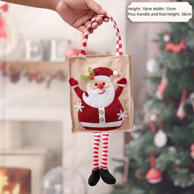 Ziemassvētku radoši dāvanu maisiņi ar sarkanām baltām svītrām kājām Ziemassvētku vecītis Sniegavīrs Alnis ābolu maisiņi Priecīgus Ziemassvētkus Bērnu konfektes rokassomas