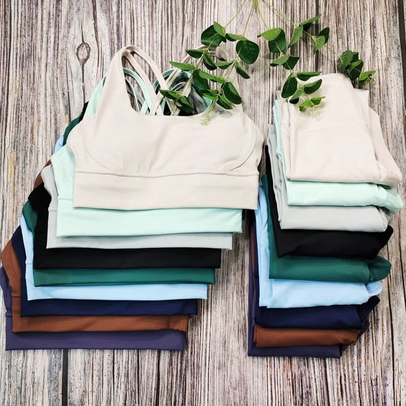 Modes sporta zāles komplekti Active Wear Sieviešu pelēks Jogas komplekts Elpojošs Sieviešu treniņu 2 daļīgs komplekts Sieviešu sporta tērpi Apģērbu vairumtirdzniecība